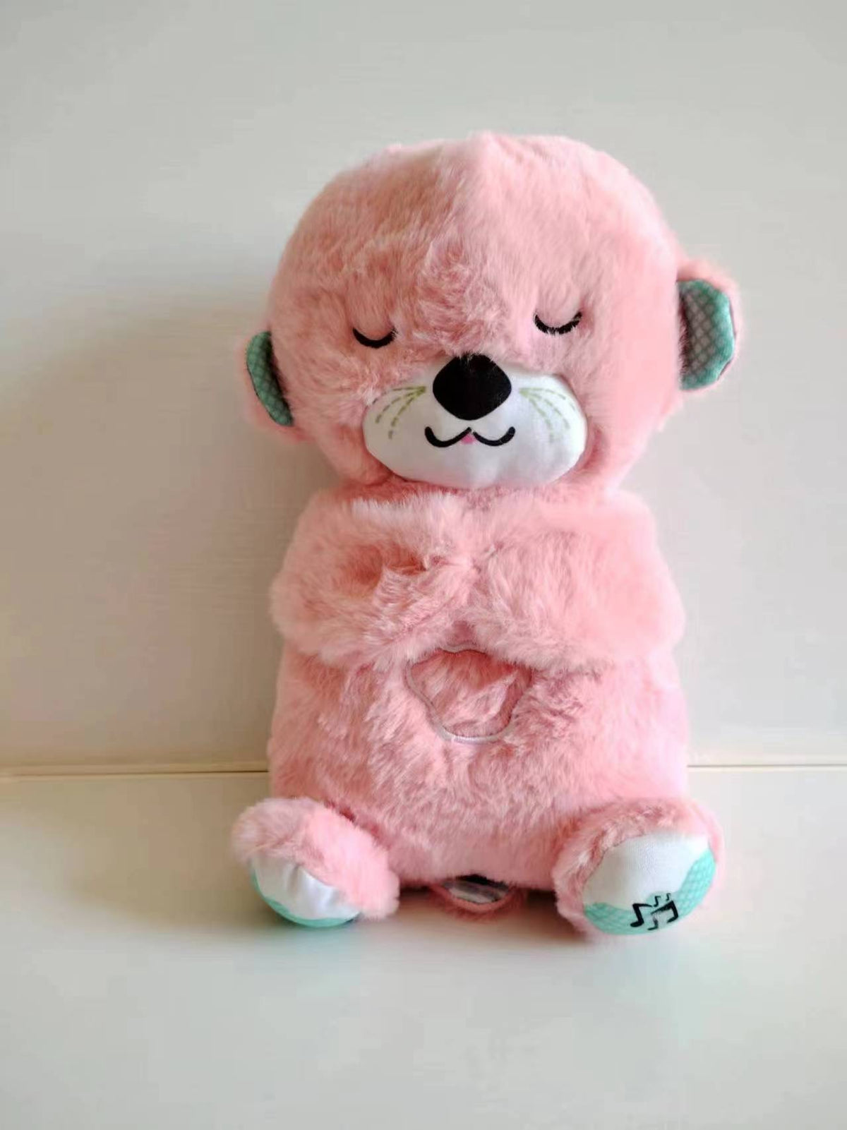 Máquina de sonido Lontra Acurrúcate y Tranquiliza Juguete de peluche portátil para bebé con detalles sensoriales música luces y movimiento rítmico de respiración