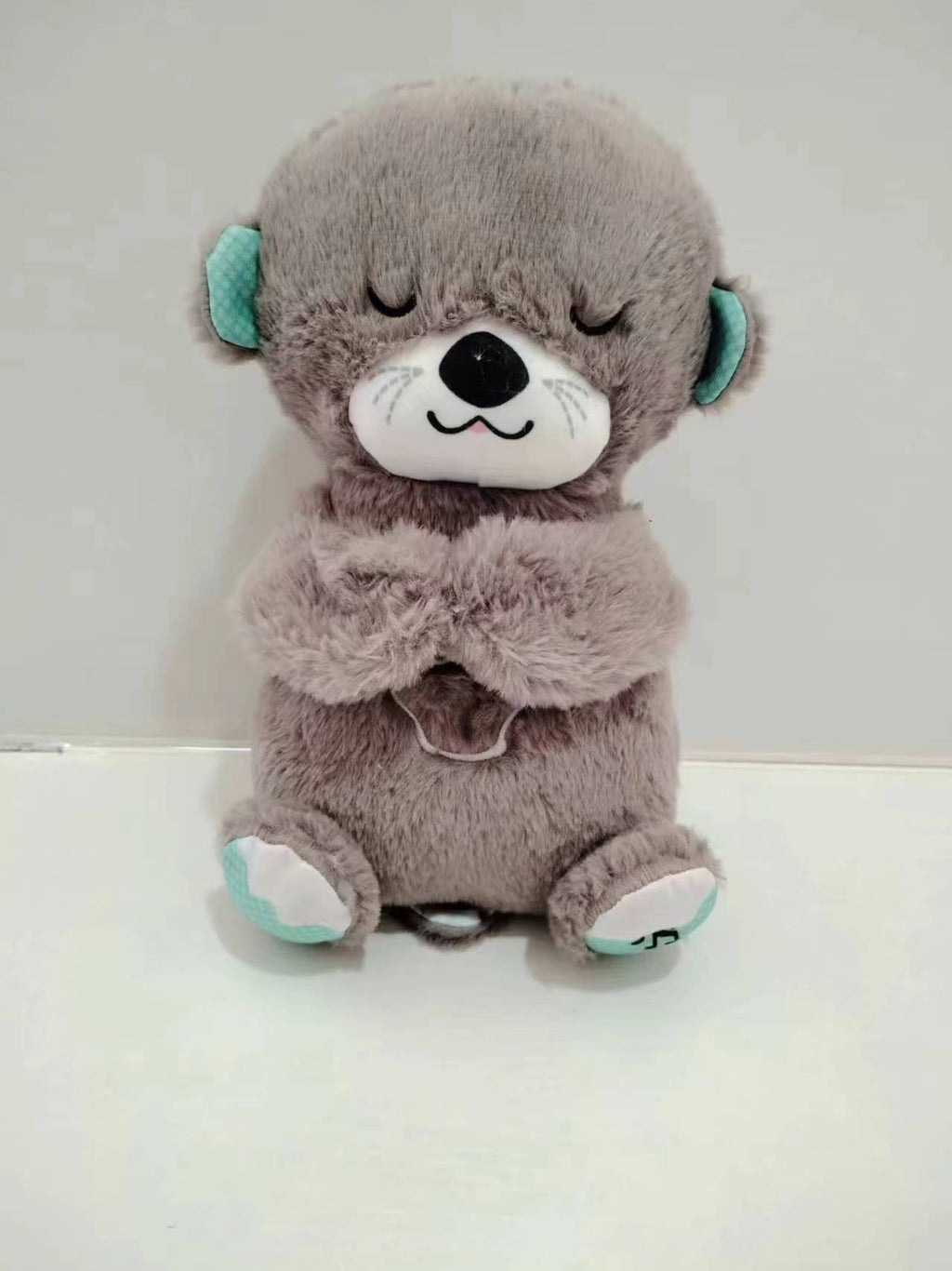 Máquina de sonido Lontra Acurrúcate y Tranquiliza Juguete de peluche portátil para bebé con detalles sensoriales música luces y movimiento rítmico de respiración