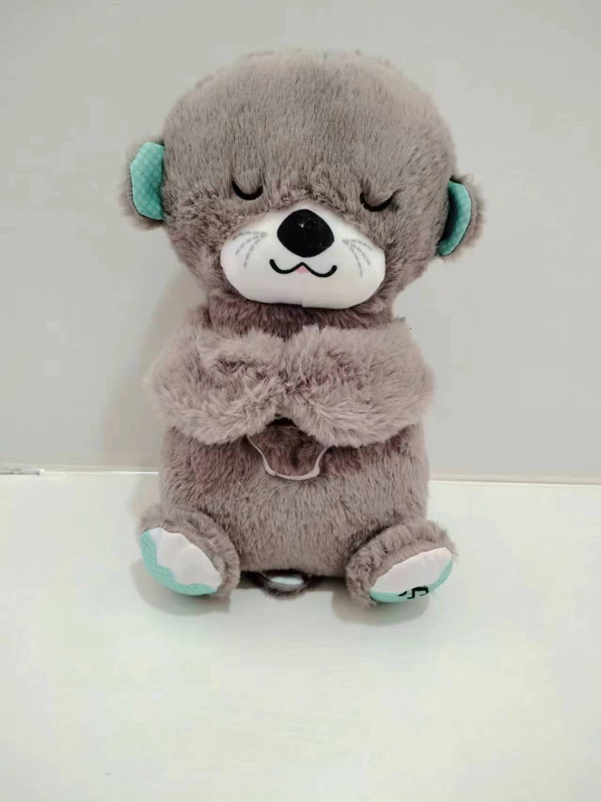 Máquina de sonido Lontra Acurrúcate y Tranquiliza Juguete de peluche portátil para bebé con detalles sensoriales música luces y movimiento rítmico de respiración