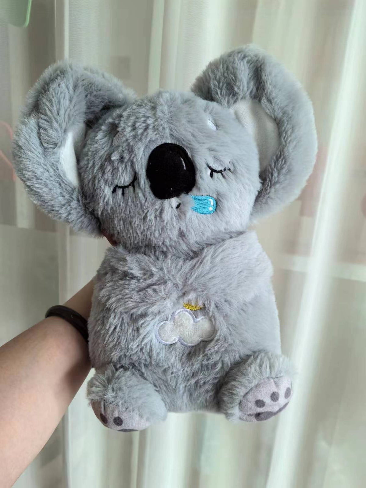Máquina de sonido Lontra Acurrúcate y Tranquiliza Juguete de peluche portátil para bebé con detalles sensoriales música luces y movimiento rítmico de respiración